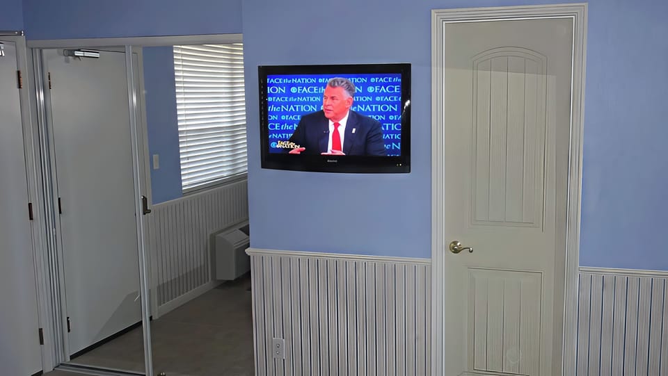 BEDROOM: 37" Wall Mounted Smart TV