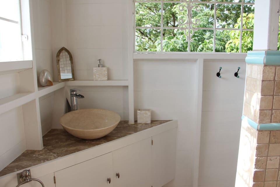 Waterfall tap into Egyptian marble sink.  Towels & hand-soap provided.
