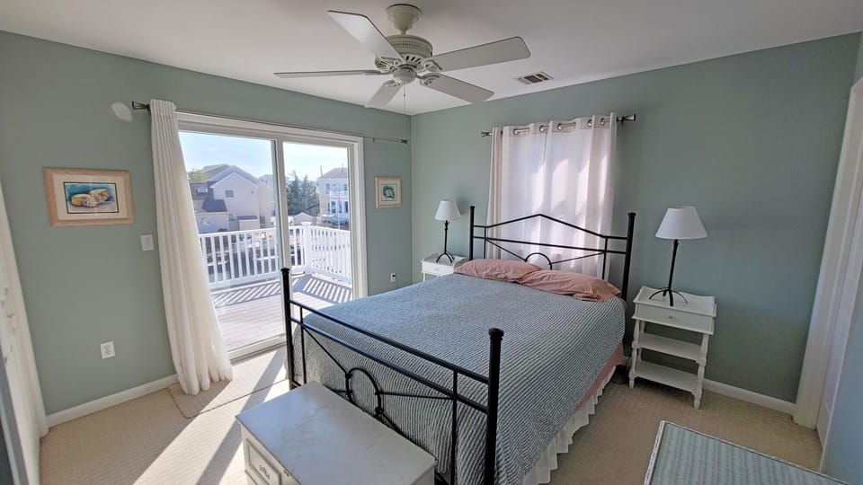 Beautiful second floor queen bedroom with adjacent upper level deck. 