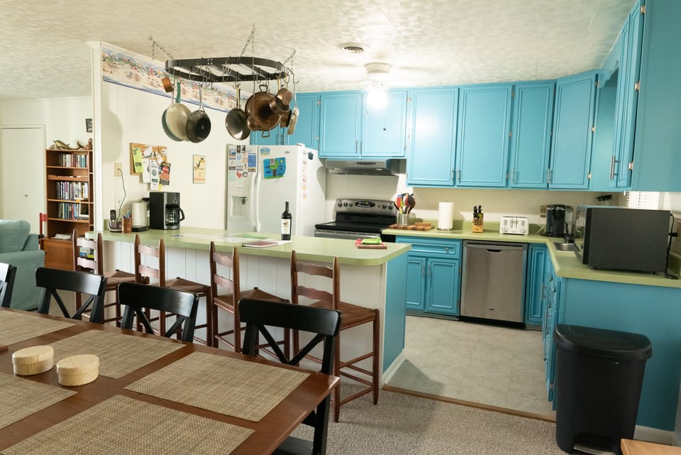 View of fully equipped Kitchen from dining area.  