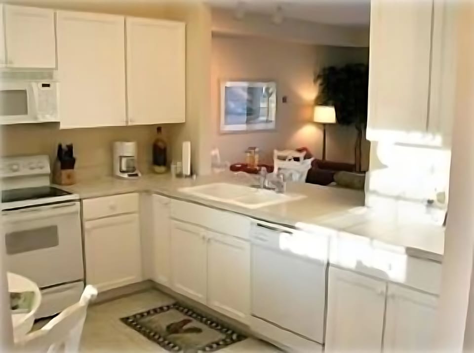 Fully stocked kitchen with a view thru to my Family Room