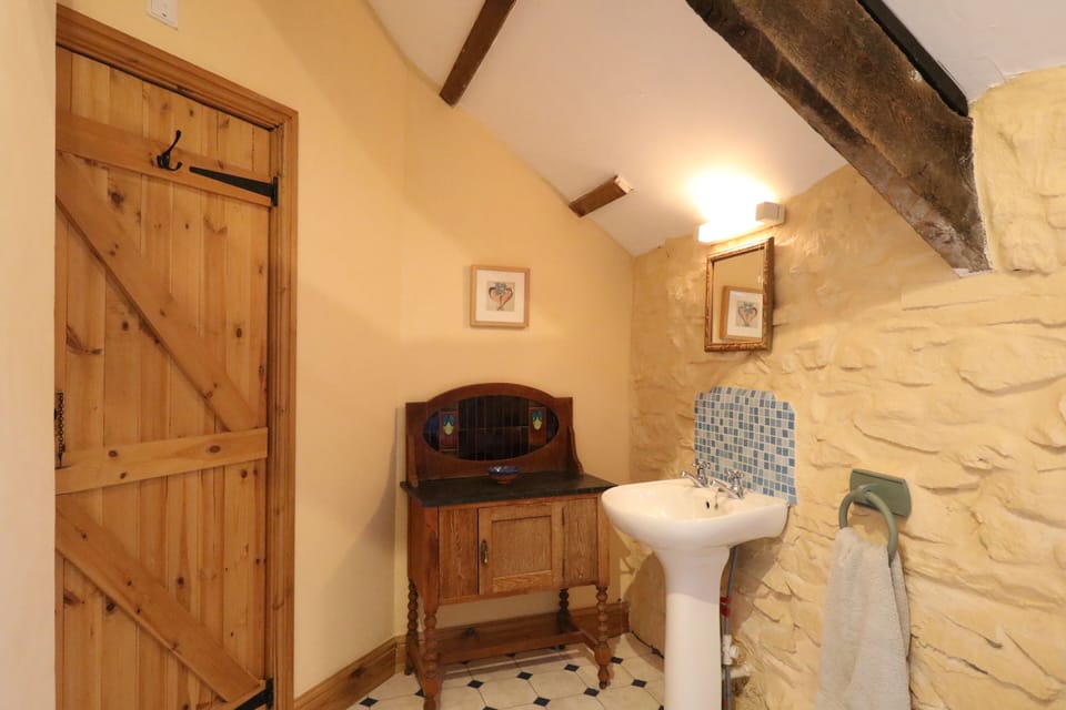 The bathroom, with original exposed beams.