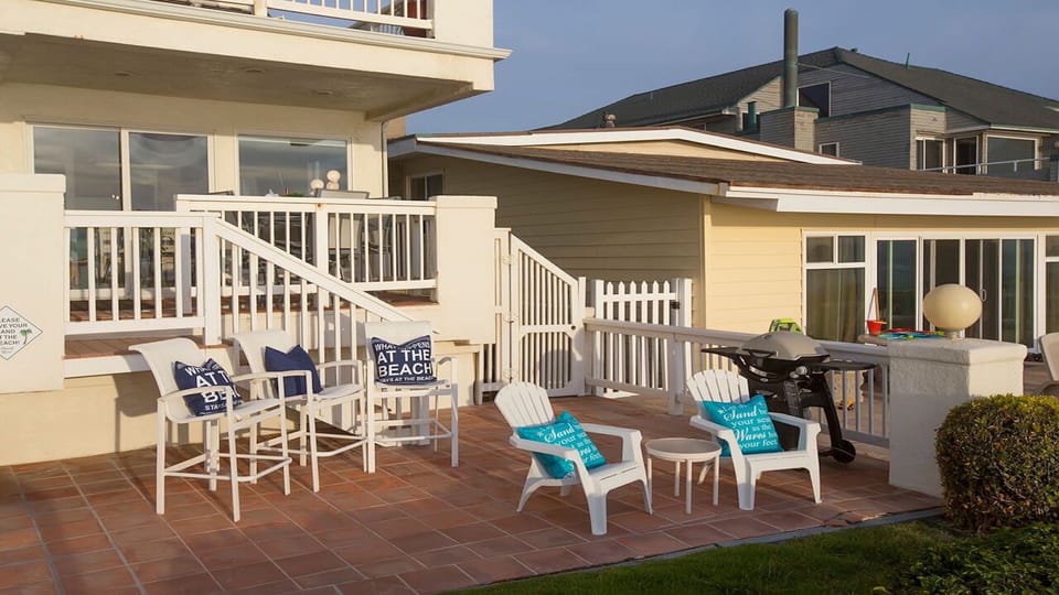 Enjoy dining on the deck and relaxing on our Patio steps from the beach!