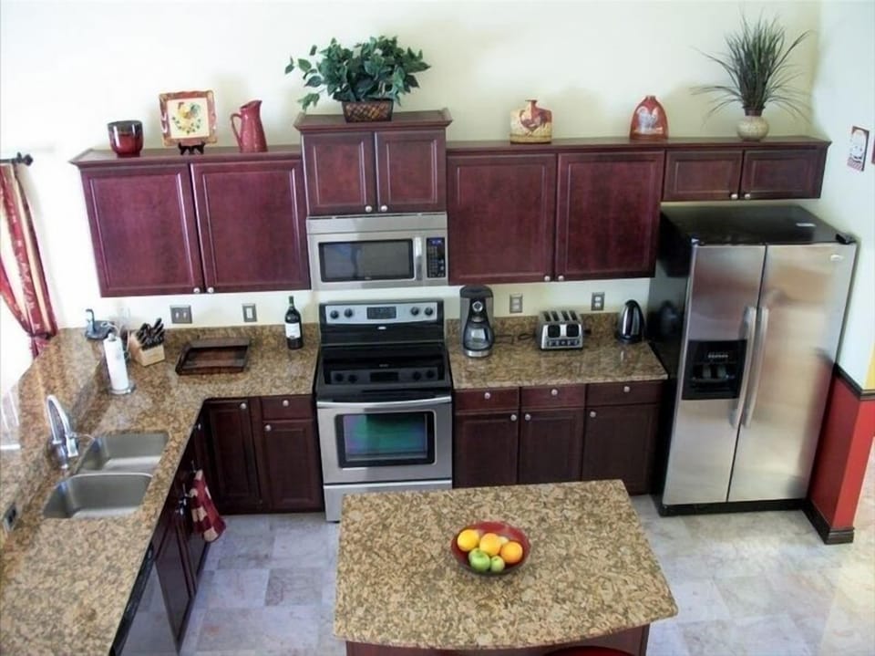 Looking down  from stair landing to kitchen