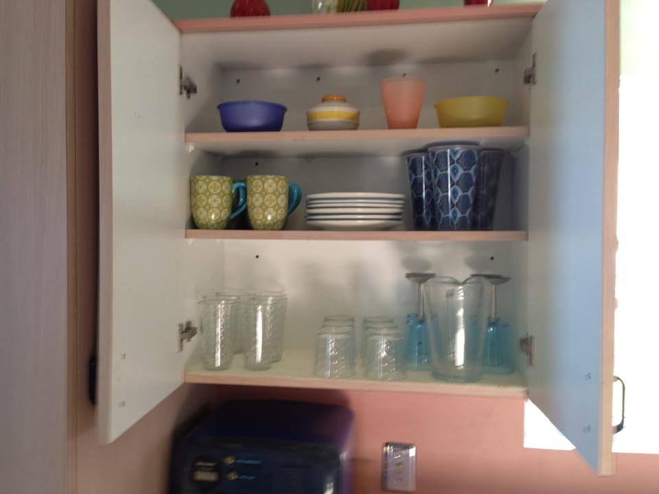 Complete sets of glasses and dishes and utensils.
