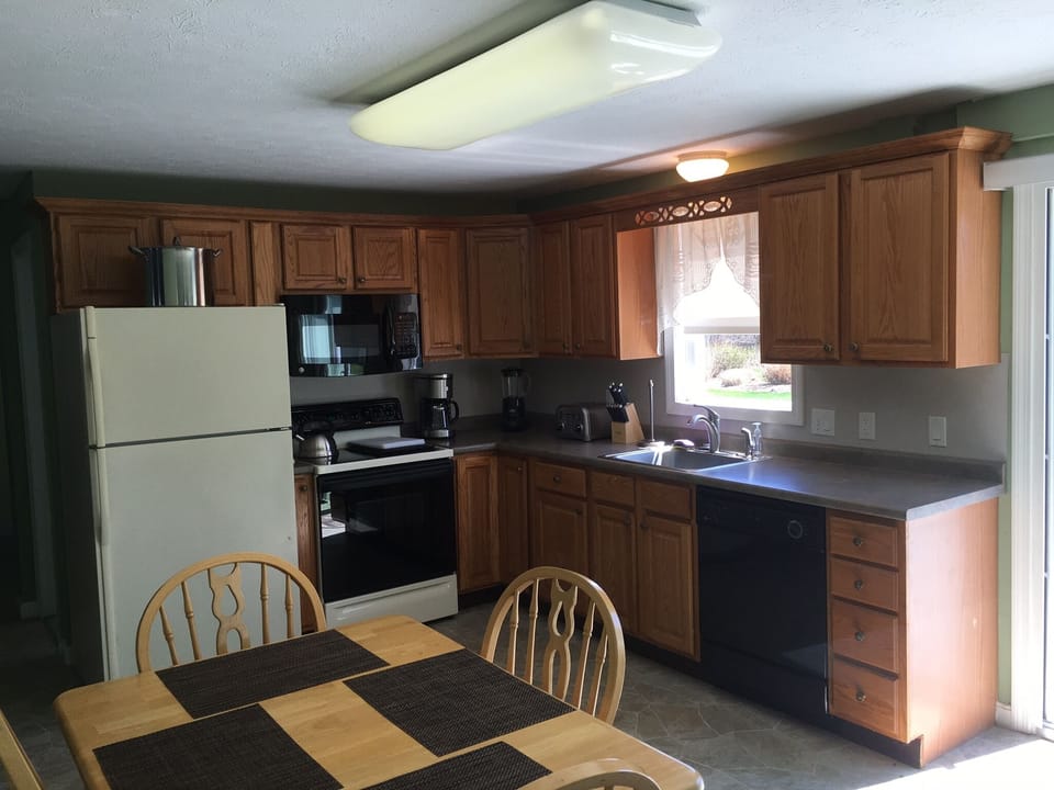 Fully equipped kitchen with dinette table.  