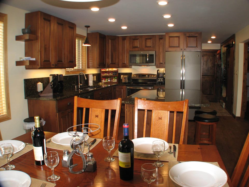 Well lit kitchen, under cabinet lighting, and dining area, all dimmable.