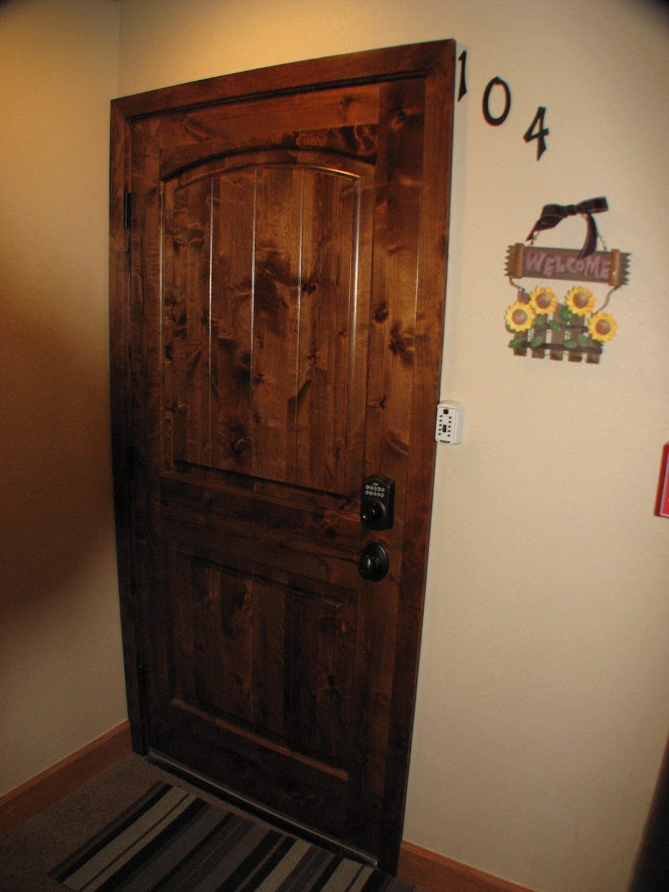 Beautiful knotty alder entry door with keyless entry.