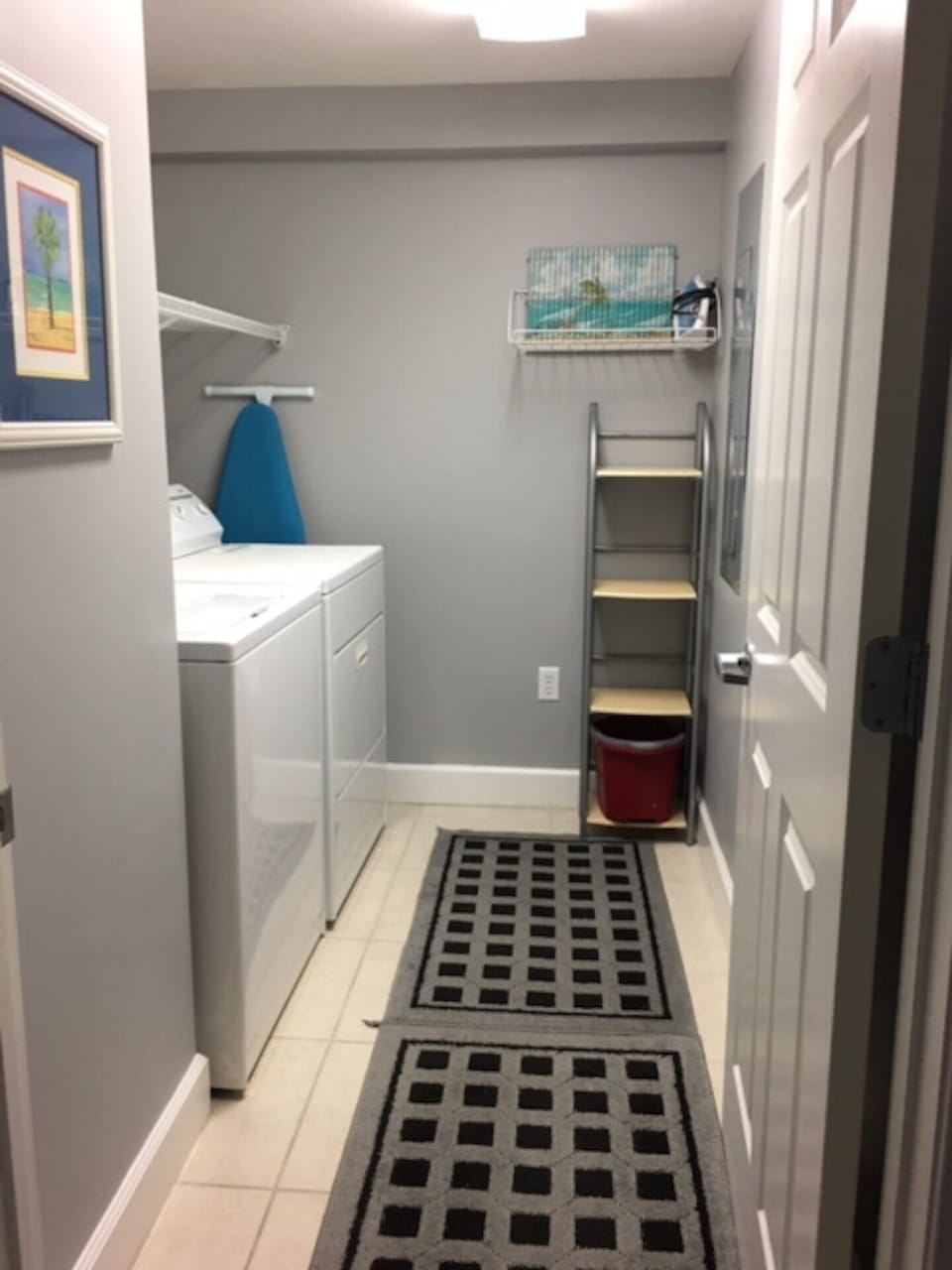 Full size washer and dryer in utility room