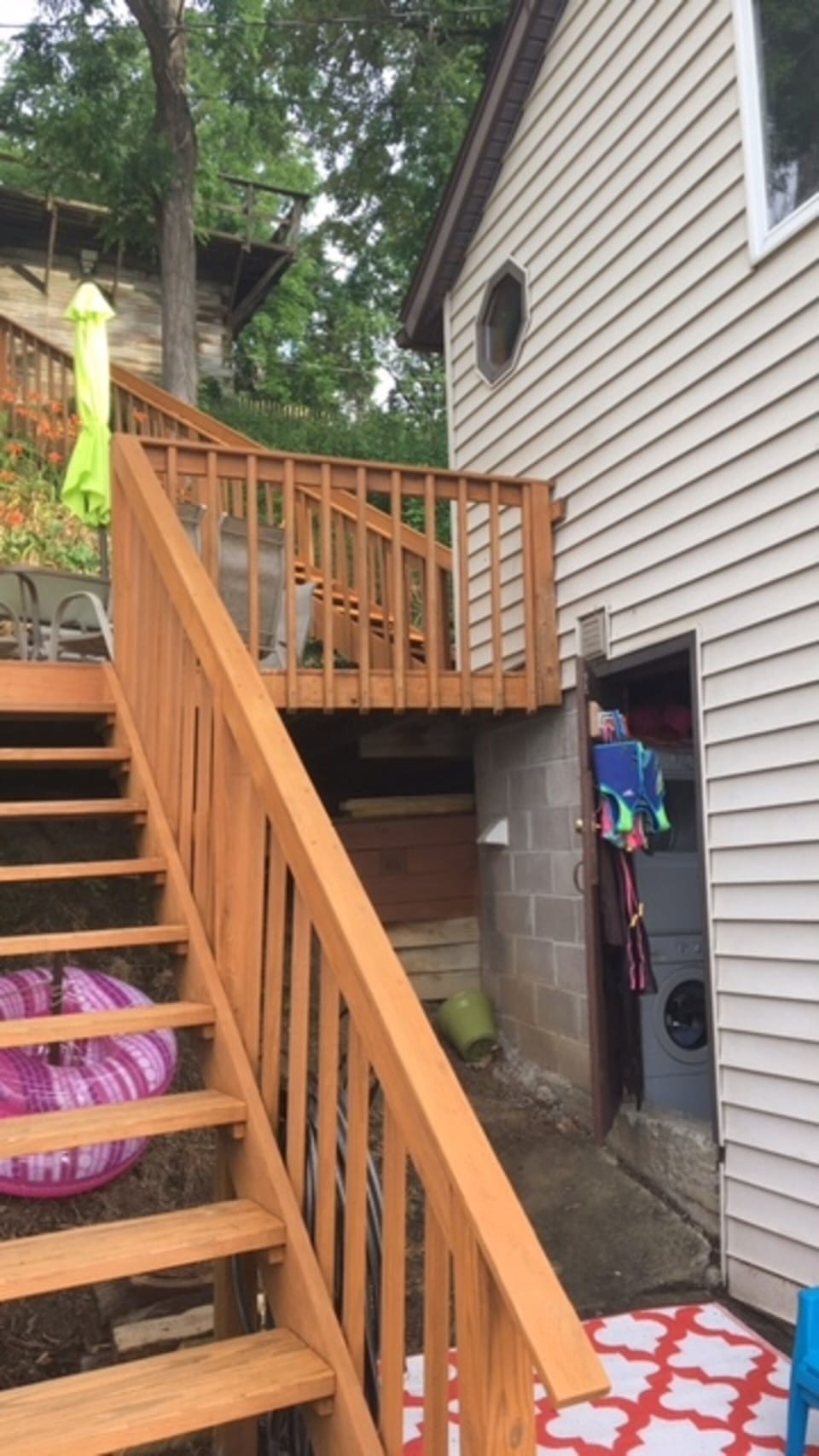Steps to picnic table/grill,  parking above and storage closet with washer/dryer