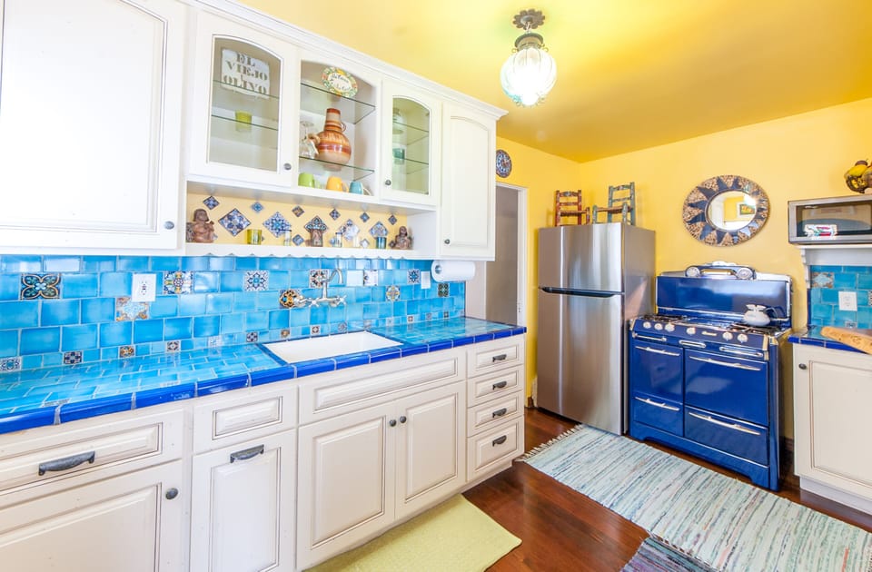 New Cabinets, New tile counter tops, New Fridge, new microwave oven.