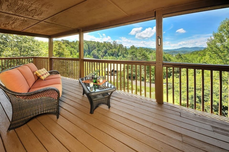 - Covered balcony with cozy seating and scenic views   - Sip drinks while watching the Smoky Mountain skyline   - Serene outdoor space for quiet morning moments