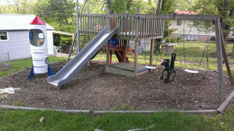 Children enjoy the fenced backyard.