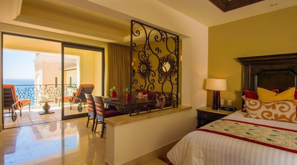 Bedroom area with dinning table for 4 and balcony.