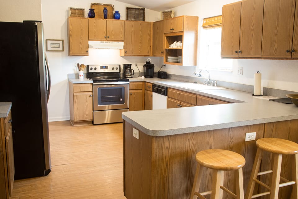 Spacious kitchen with bar seating—cook, gather, and enjoy your thyme at Rosemary