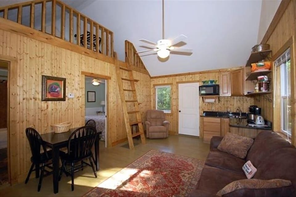 Interior of Cabins; bedroom, kitchen area, bath and sleeping loft