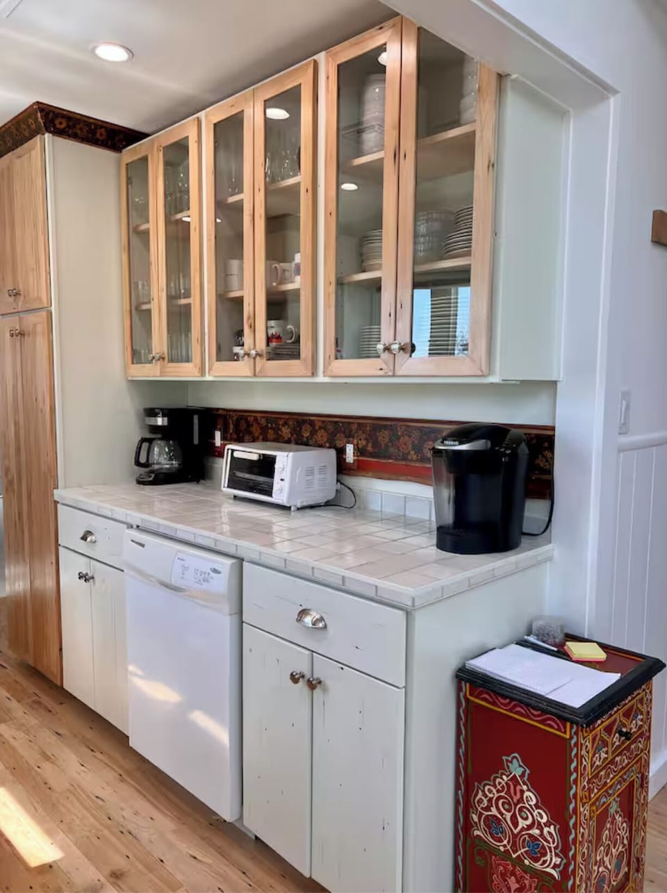 A bright, fully-equipped modern kitchen. Plenty of dishes for large family meals