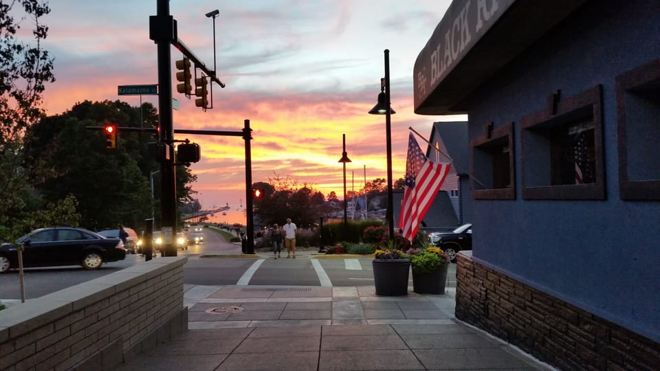 Sunset view from town down Harborwalk to pier / beach