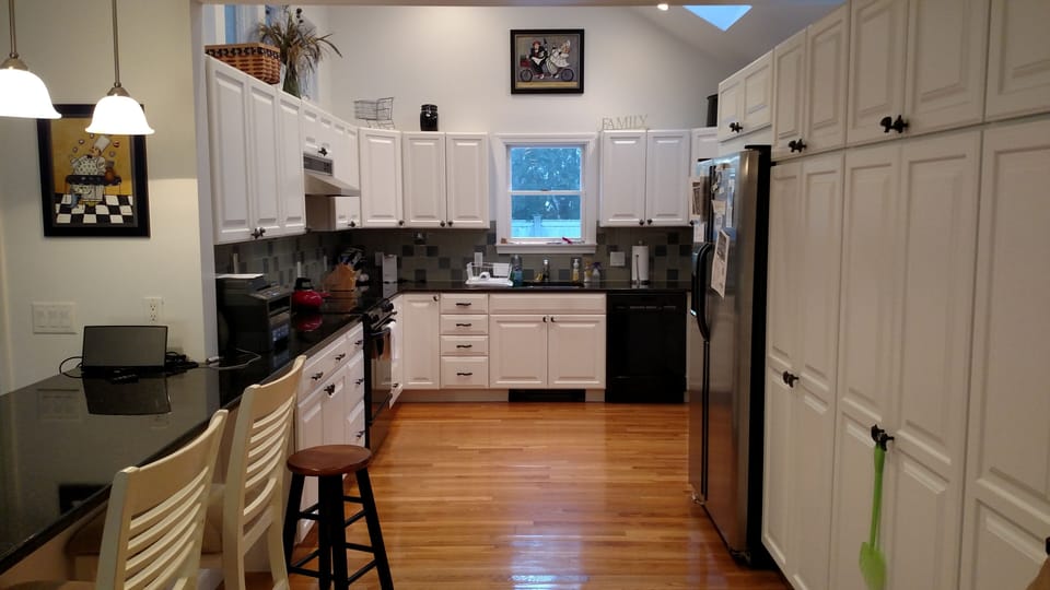 Kitchen with granite counter. Bar seating for 6/8