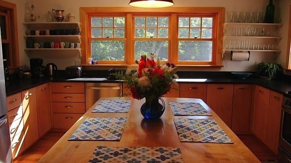 kitchen island is a perfect gathering place for coffee or an informal meal