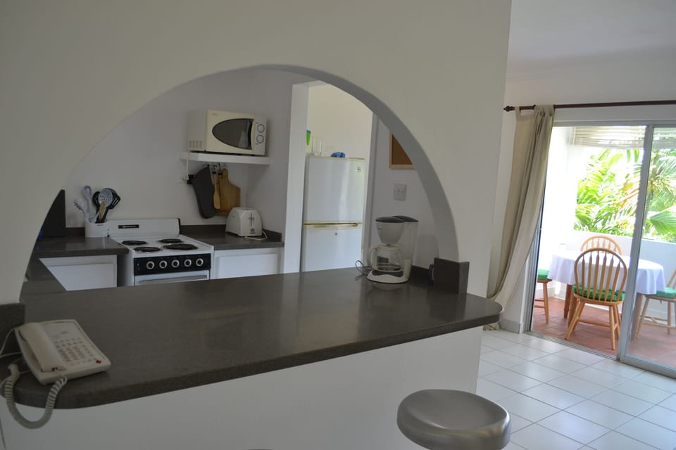 Breakfast bar and kitchen looking towards dining area
