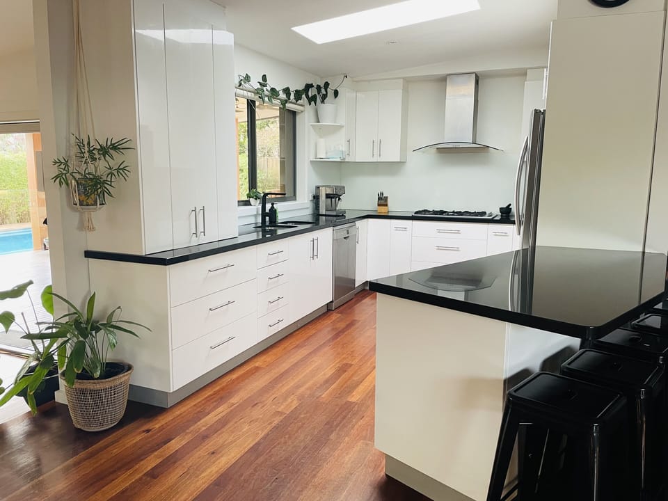 Well equipped kitchen overlooking deck/pool