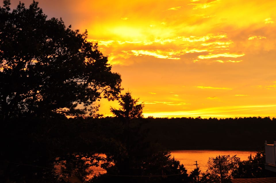 Sunset from Porch...In a Rocking Chair reflecting on a beautiful island day!