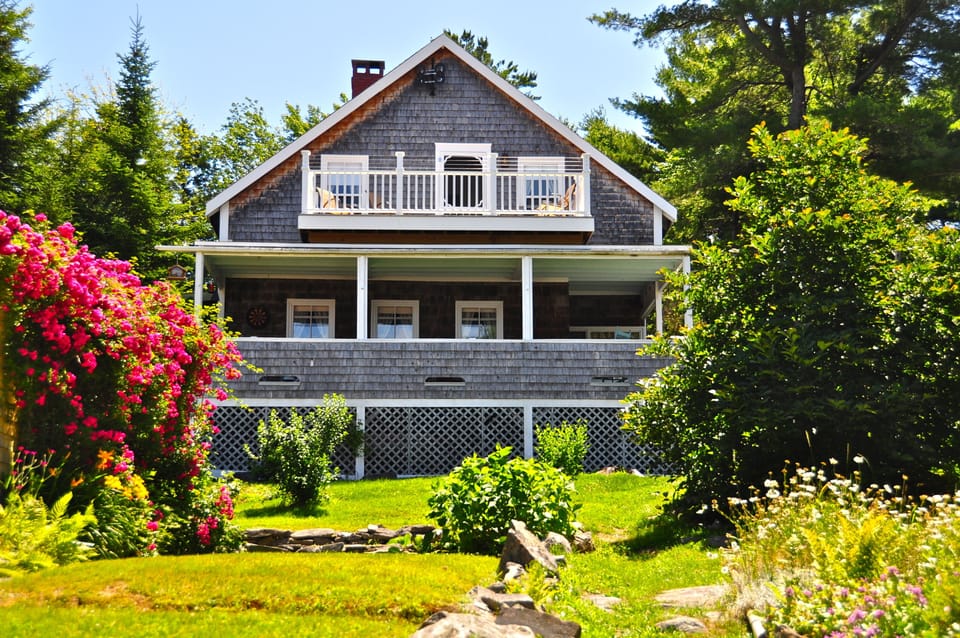 Front of Cottage..Porch and Deck overlooking Casco Bay.Full of Boats and Sunset.