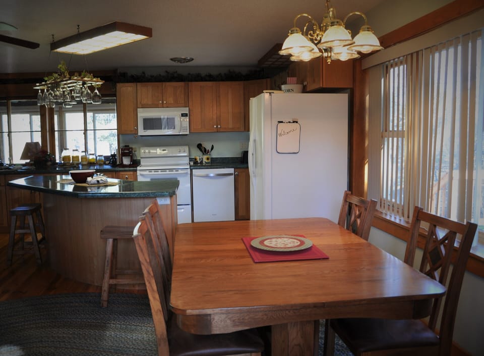 Kitchen and island with dinning room table
