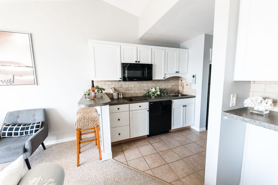 Mini Kitchen with stove, microwave, refrigerator, washer and lg toaster oven.