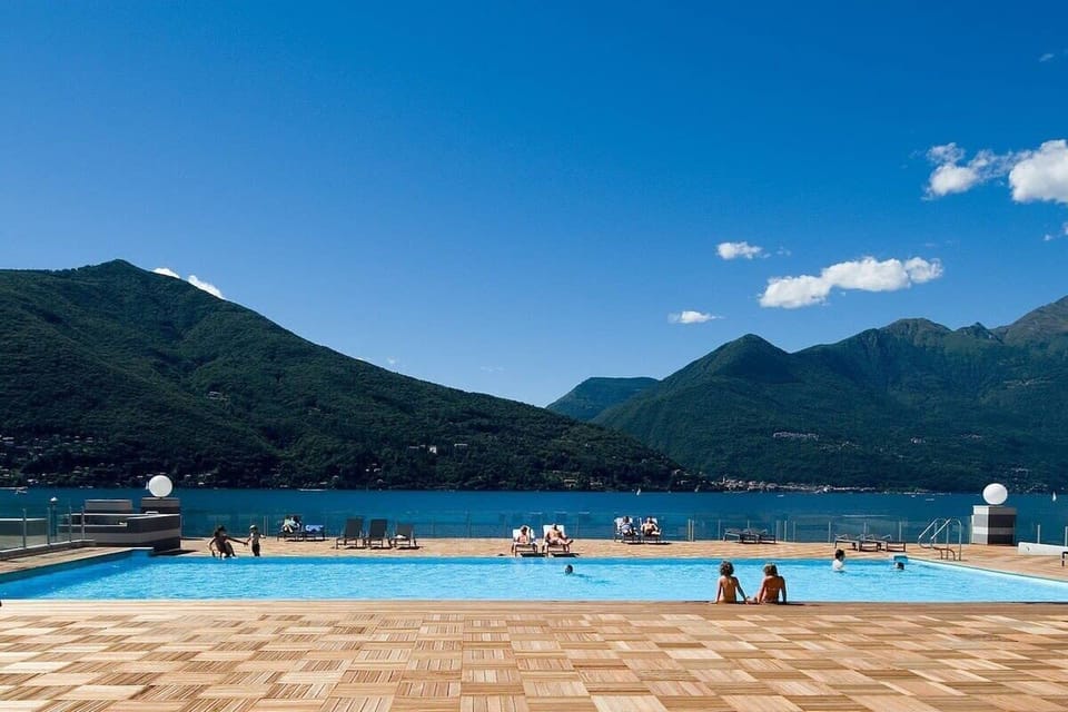 The communal swimming pool enjoys stunning views of the Lake