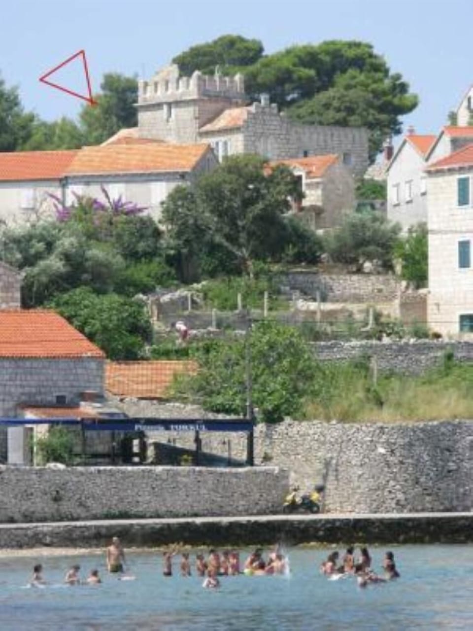 The sandy beach is a minute away from the house