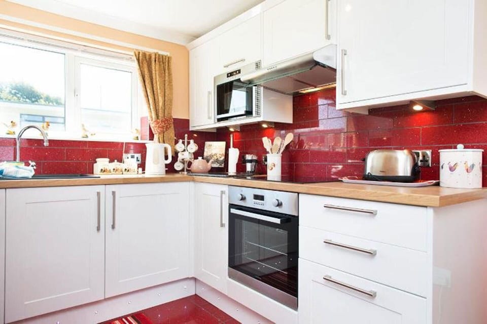 High spec kitchen, including washing machine, freezer and microwave.