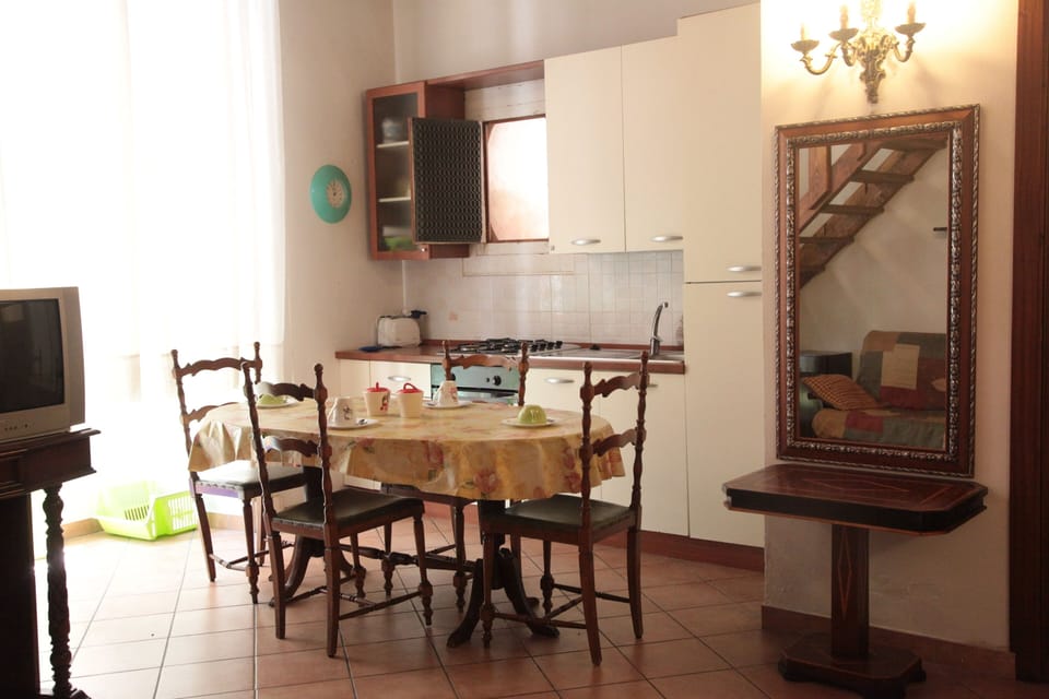 Fully equipped kitchen with table and chairs.