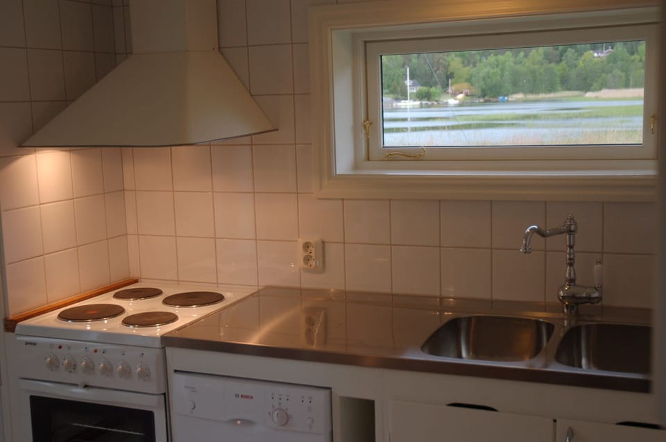 Kitchen with dishwasher and ocean view.
