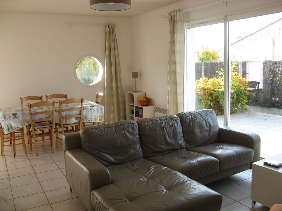 Open plan lounge and dining area looking out onto patio