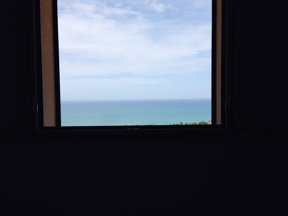 View out of window from main bedroom, sitting in bed