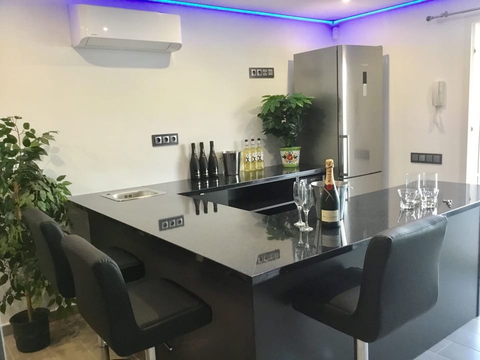 Bar with seating ... full size fridge/freezer.. .. view to beach 