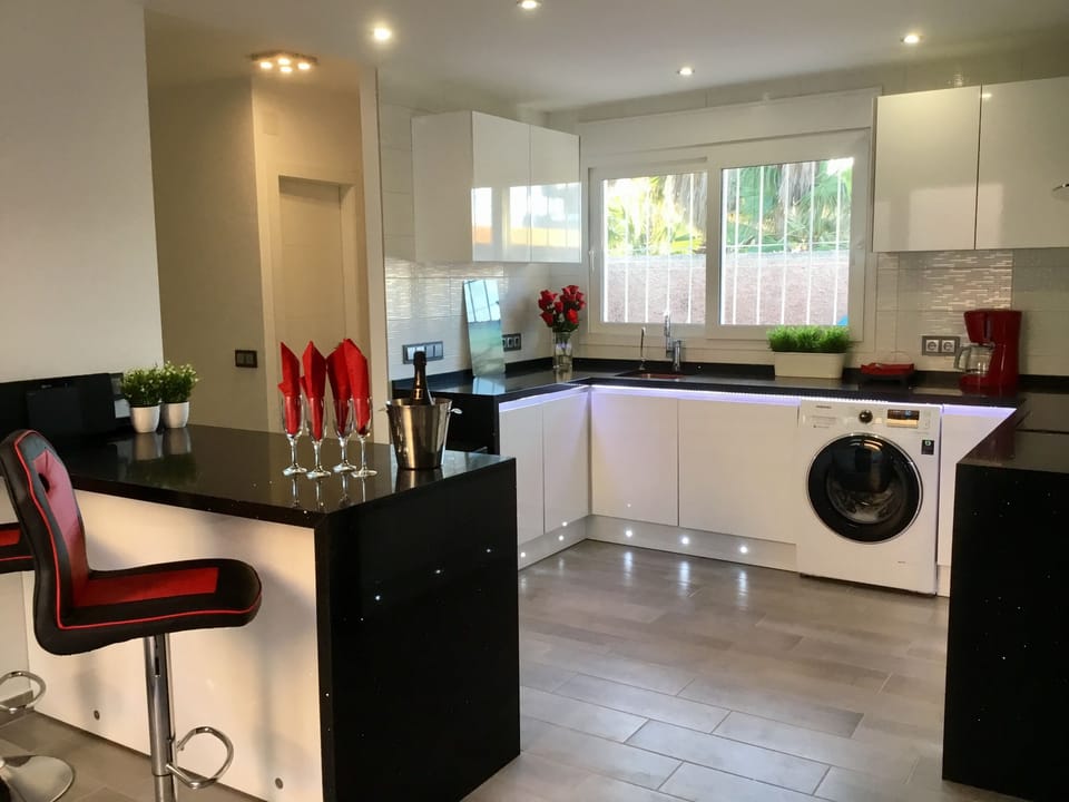 New modern Kitchen with breakfast bar. Dish-washer/washing machine/microwave .