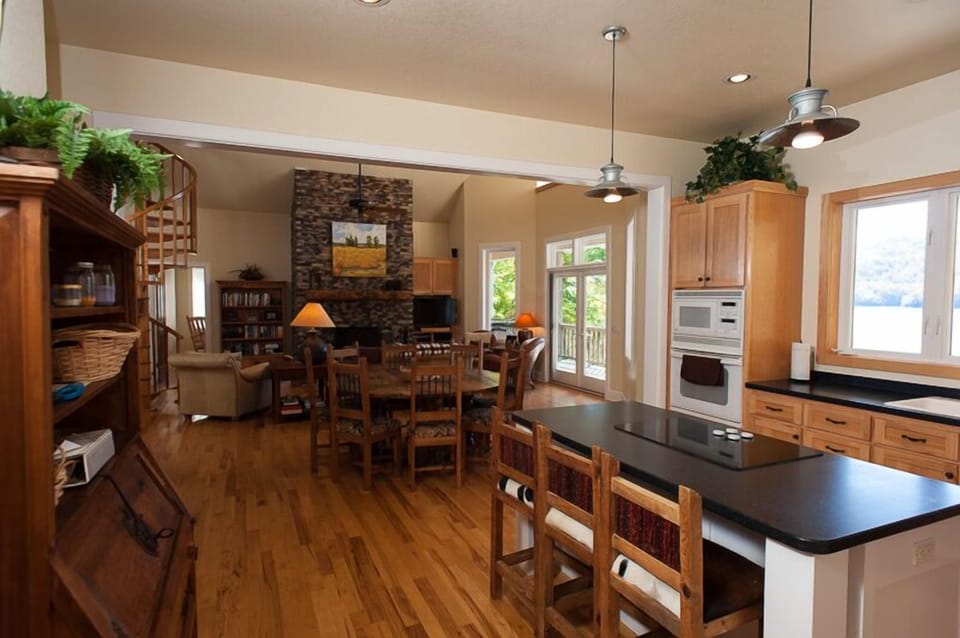Main level with open kitchen, dining and great room - all with lake view.