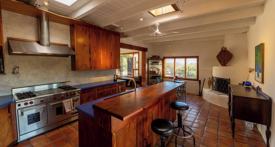 Kitchen: custom mesquite cabinets throughout the house
