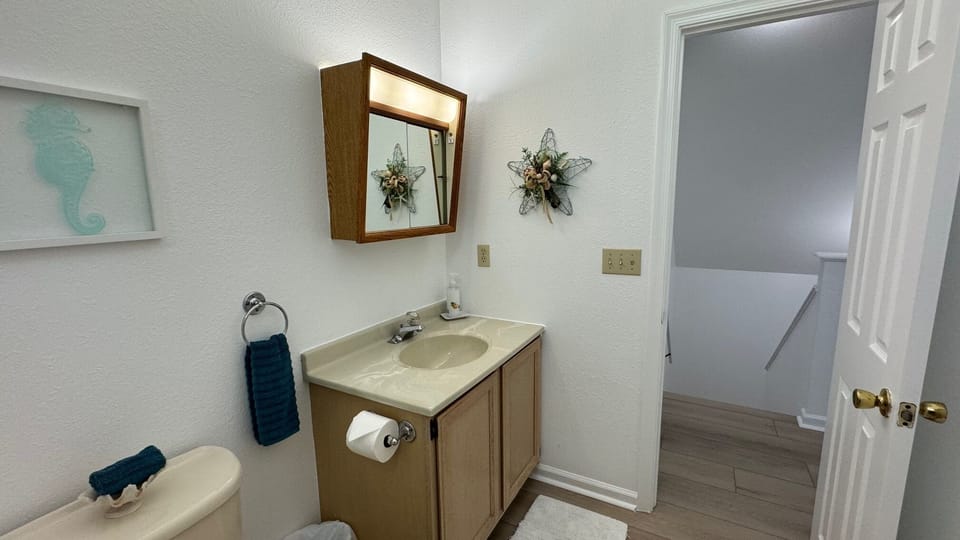 Bright bathroom stocked with essentials for your comfortable .
