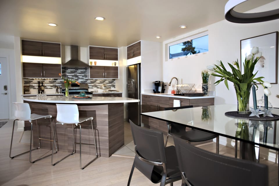 Kitchen Area with Island Bar for entertaining guests in Living and Dining Areas 