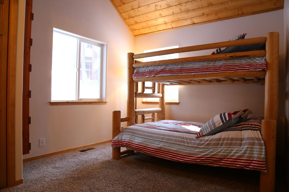 Spacious Guest Bedroom With Twin Over Full, Rustic Bunk Bed.  Dresser and Closet