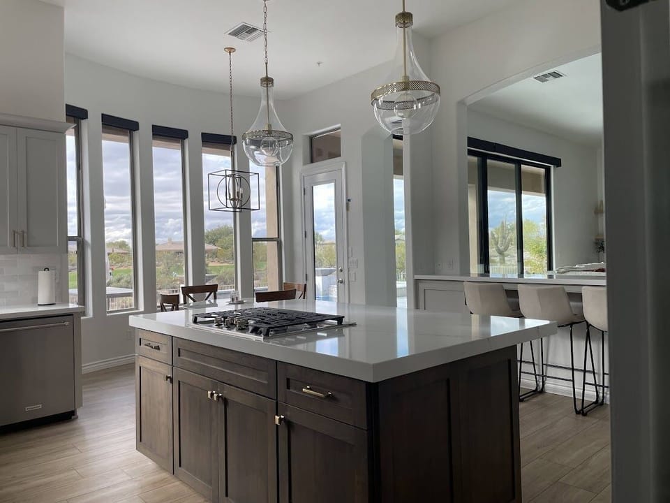 Lots of light filters into the kitchen with tall windows in the dining nook