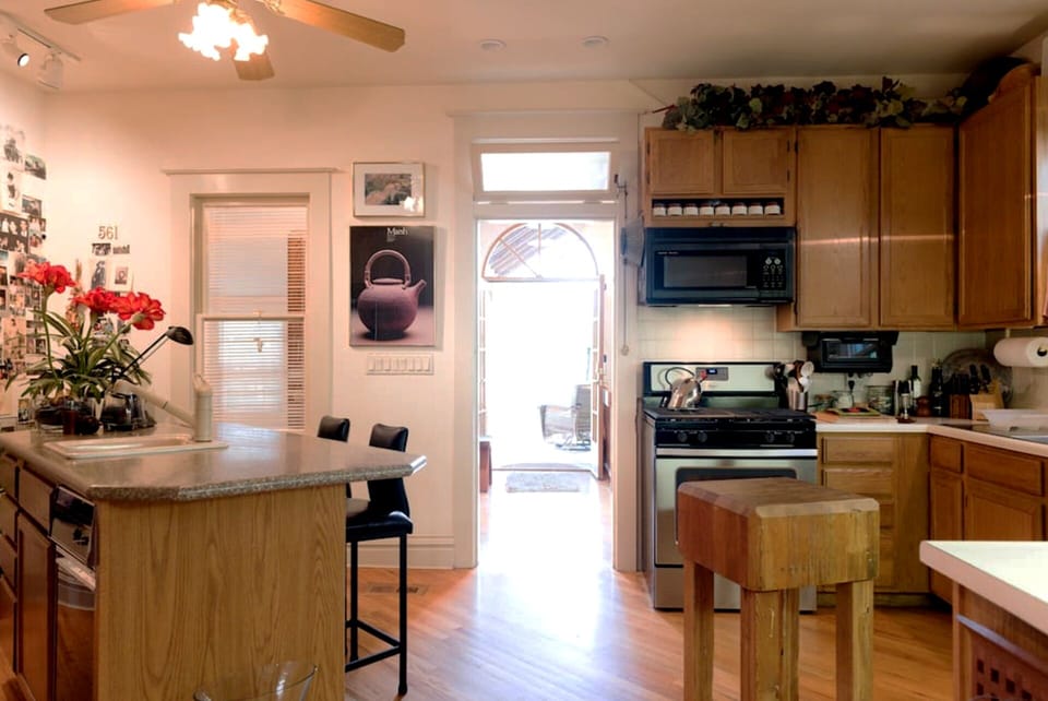 View from kitchen, past gallery and French doors to back deck and yard.