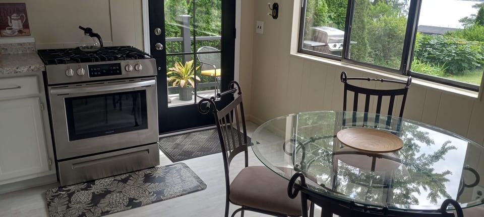 Kitchen: Opens to back porch.