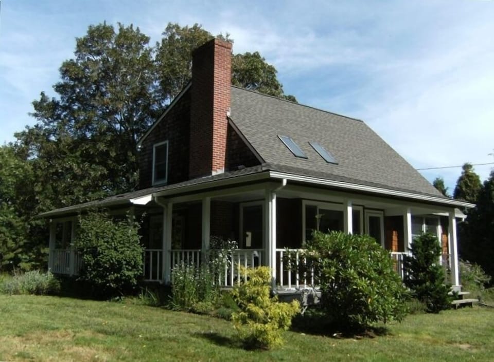 Windward Cottage, view of the property and the large wrap-around porch.