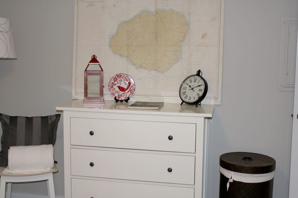 Bedroom, with queen size bed, has plenty of storage. Full dresser and closet with iron and ironing board.