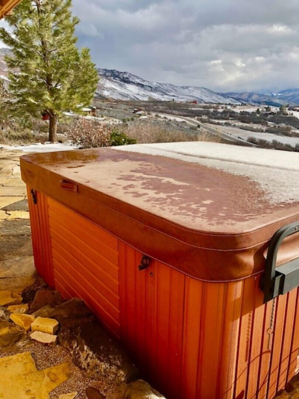 Outdoor hot tub with view of mountains, outside  family room.  Seats 6 people.